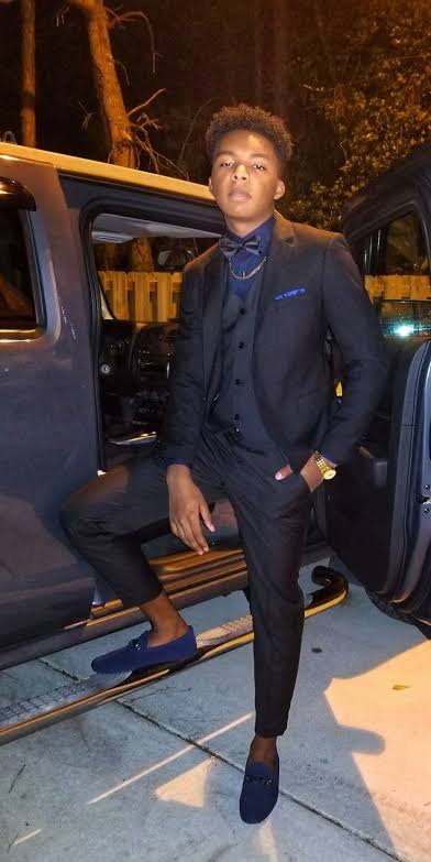 black 3 piece homecoming suit on guy